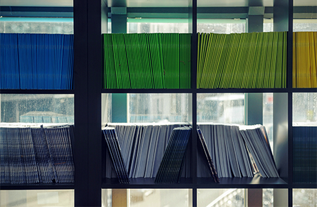 Stack of journals on a bookshef